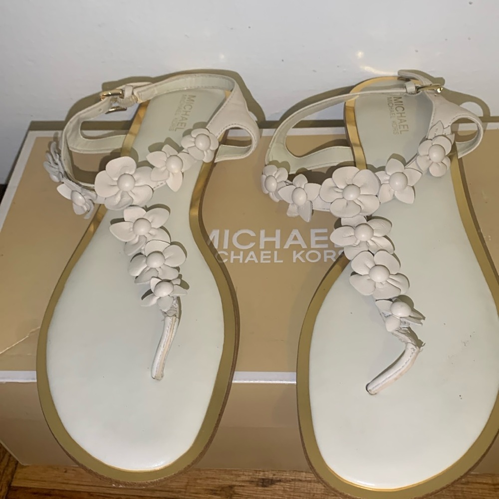 9.5 Micheal Micheal Kors sandals. With flower in cream colored  shoes